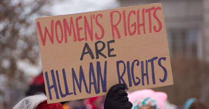 Protest sign with women's rights slogan