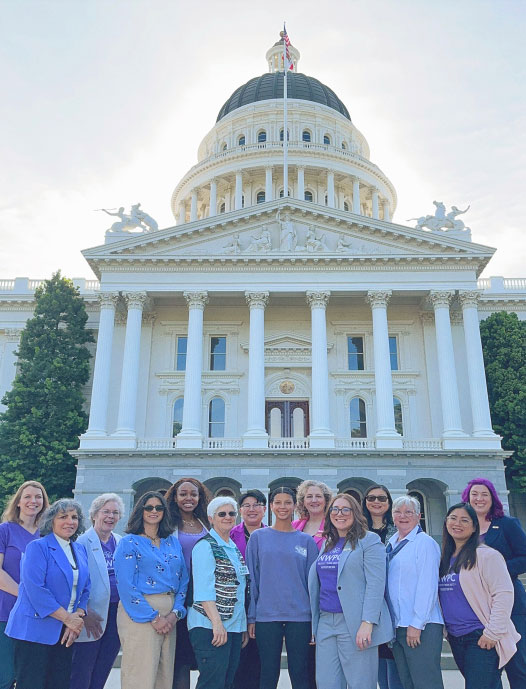 women in front of statehouse