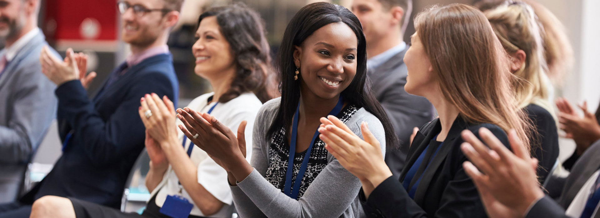 picture of women in a group applauding